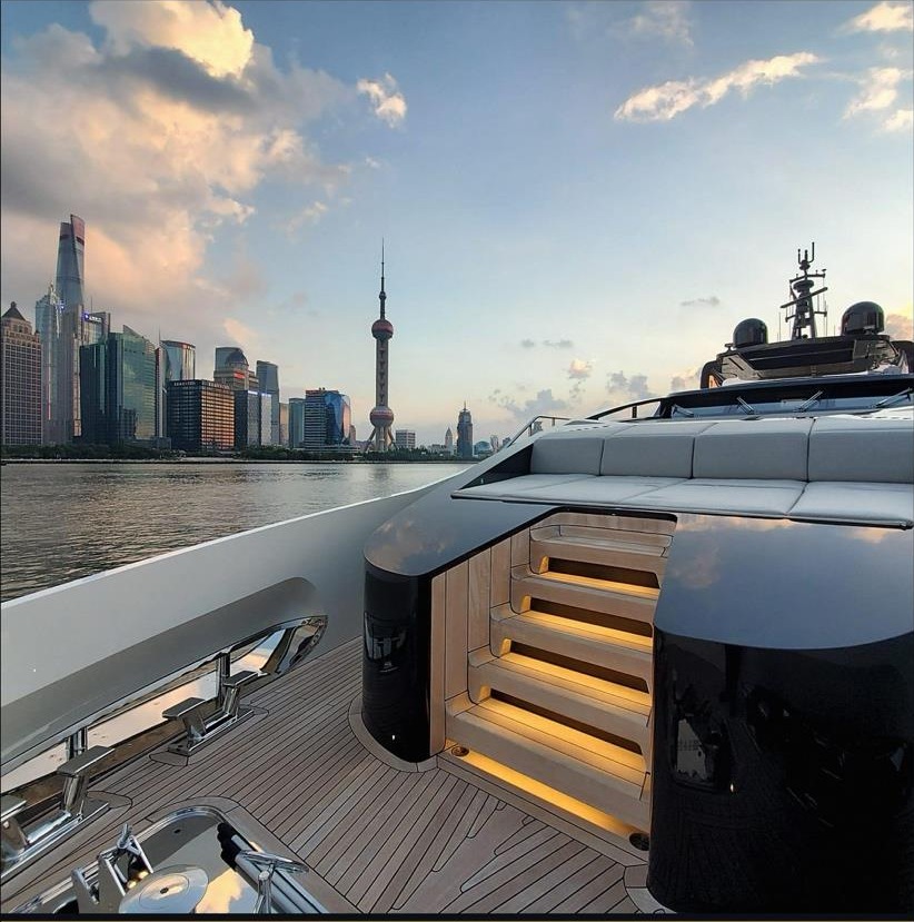 Yacht aft deck facing the Shanghai skyline at dusk during the T.I.S.G. Asia Roadshow
