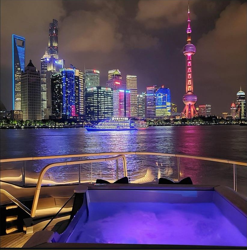 Onboard jacuzzi deck overlooking the illuminated Shanghai skyline during the T.I.S.G. Asia Roadshow